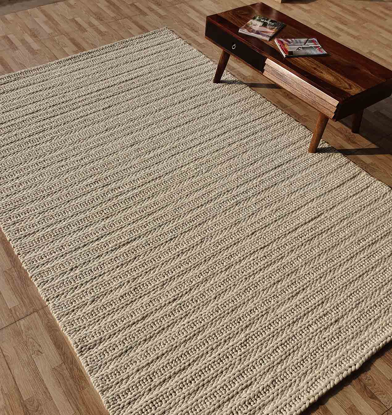 Handcrafted braided rug featuring colorful patterns and durable weave by Ramsha Carpets
