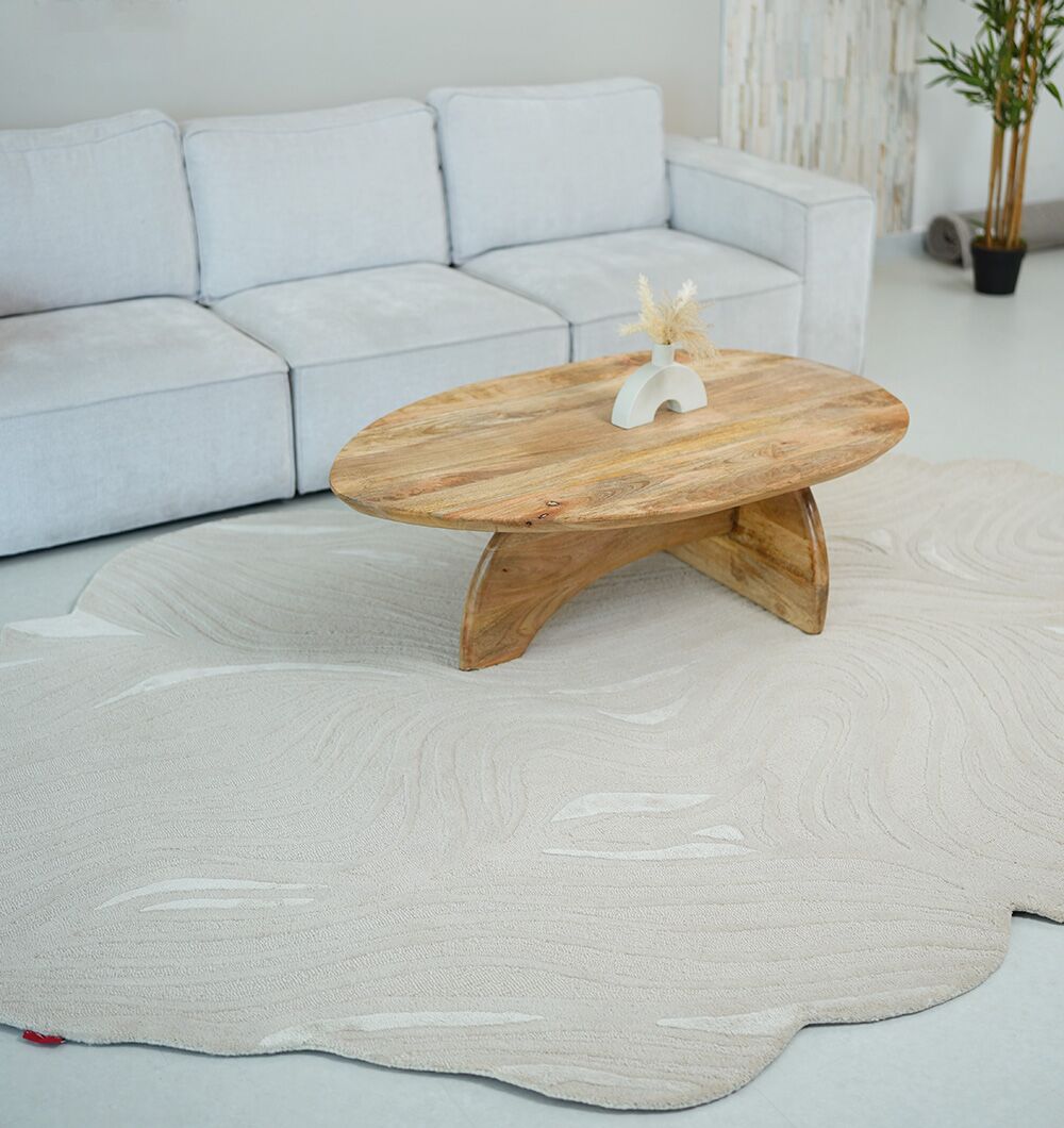 Bespoke custom wool rug with intricate floral motifs in soft neutral colors by Ramsha Carpets