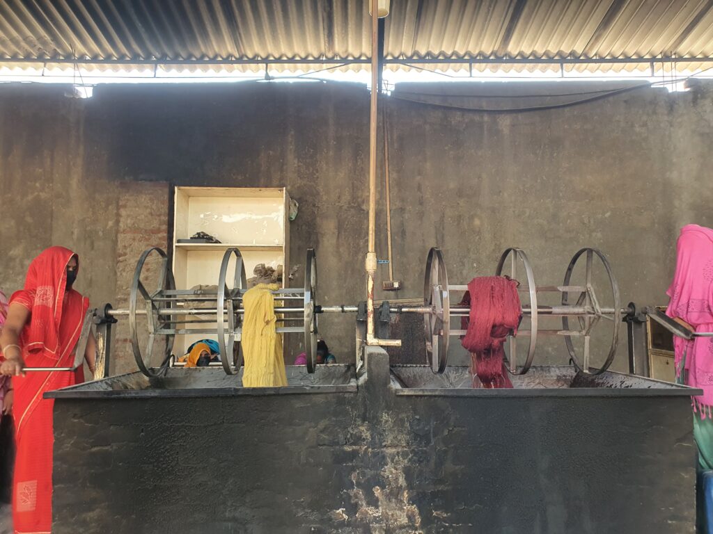 Close-up of hand-dyed wool yarns in gradient tones for a custom rug by Ramsha Carpets