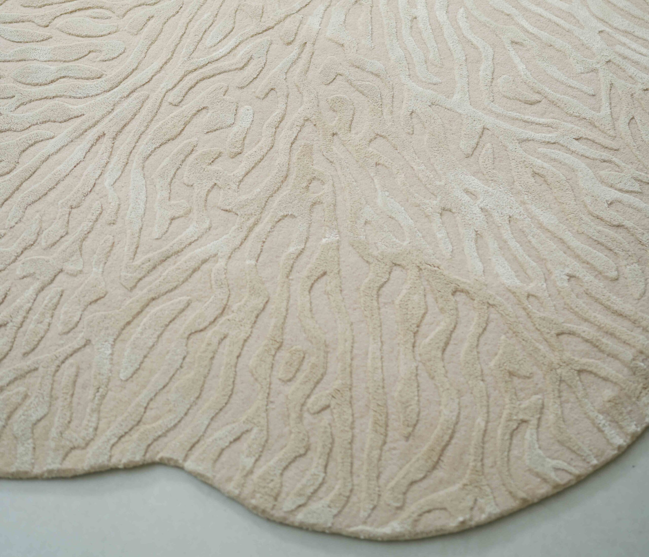 Asymmetrical custom rug crafted for a designer interior by Ramsha Carpets