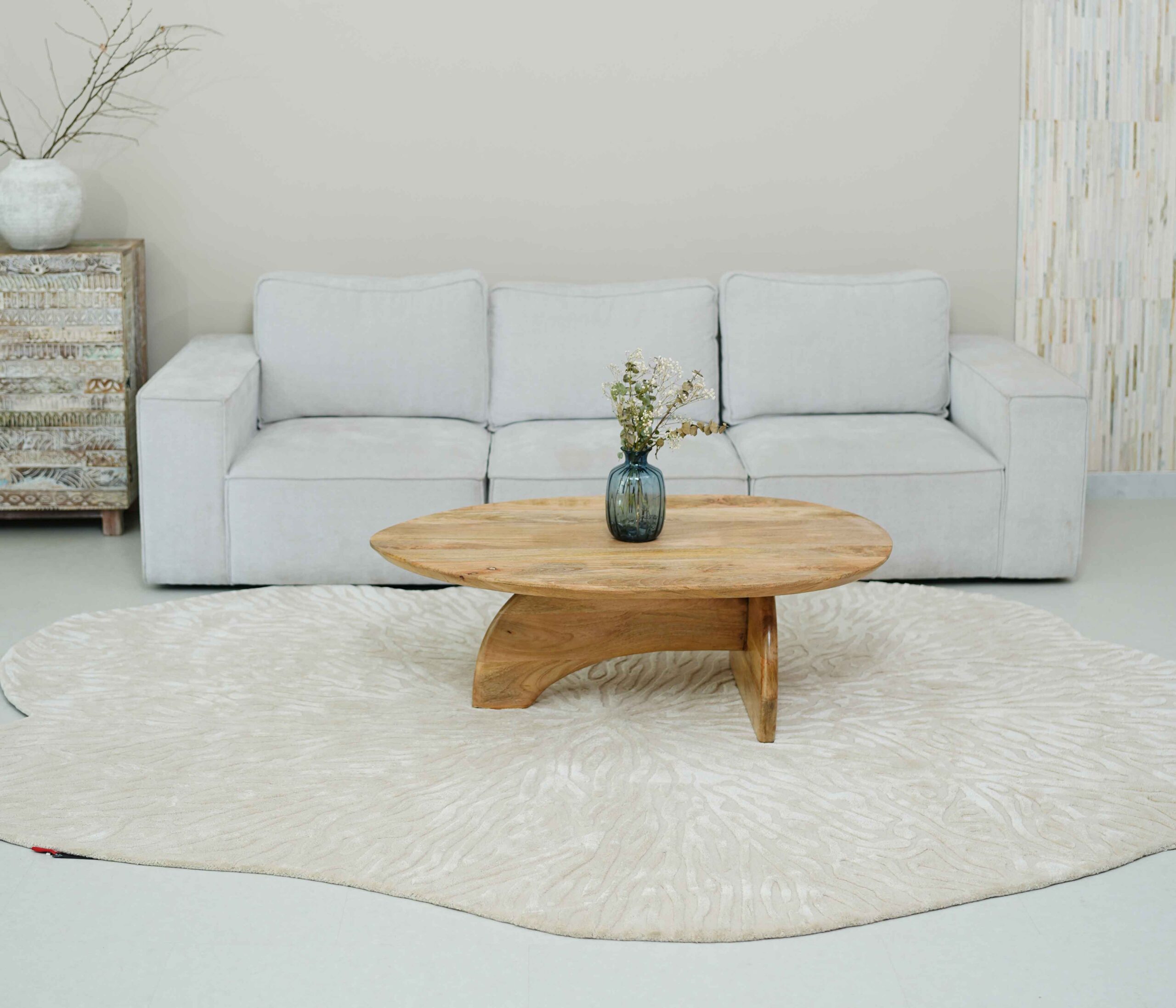 Asymmetrical custom natural flow rug crafted for a designer interior by Ramsha Carpets