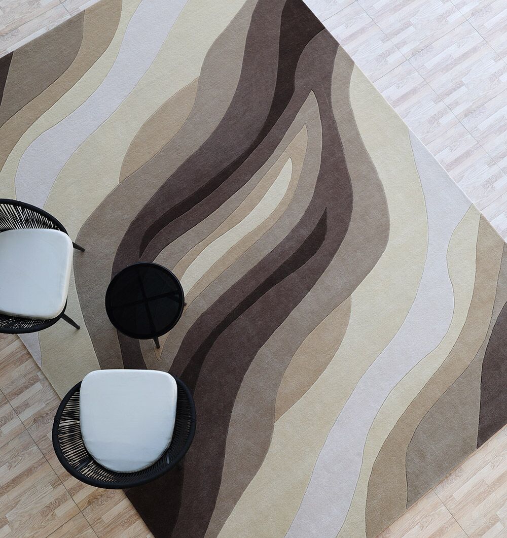 A high resolution top down view of a premium bamboo silk rug in white with parallel wave carvings