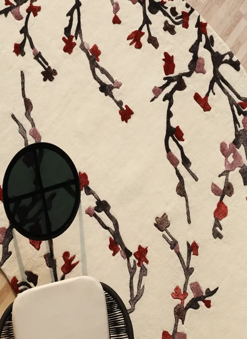 Custom rug with an unconventional geometric shape, laid in a designer lounge area by Ramsha Carpets