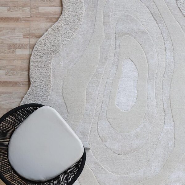 Custom artisan rug featuring handwoven textures and vibrant colors, crafted by Ramsha Carpets.