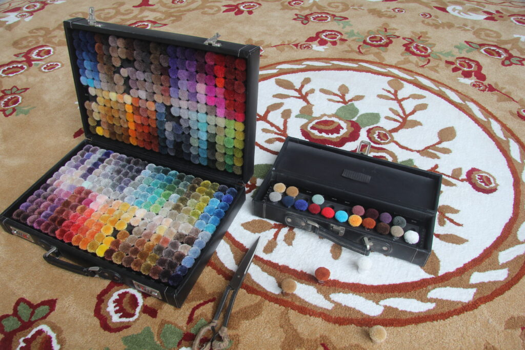 Custom rug with a corporate logo in a hotel reception area, made by Ramsha Carpets