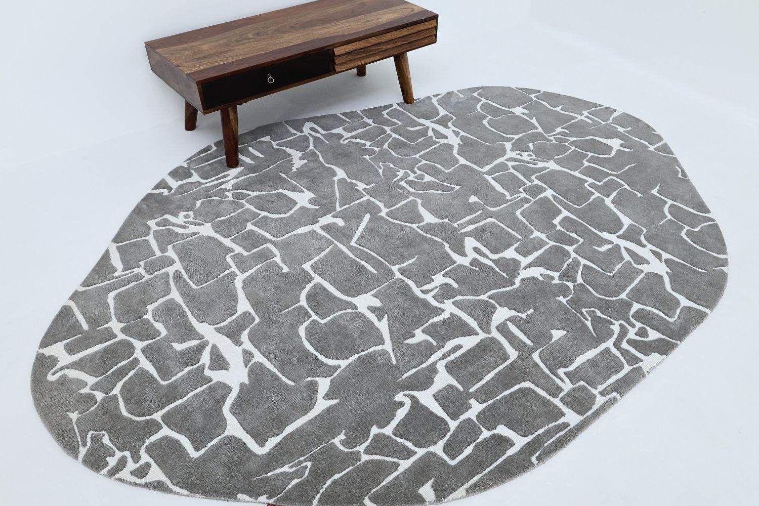 Custom-designed rug with abstract patterns styled in a high-end lounge by Ramsha Carpets