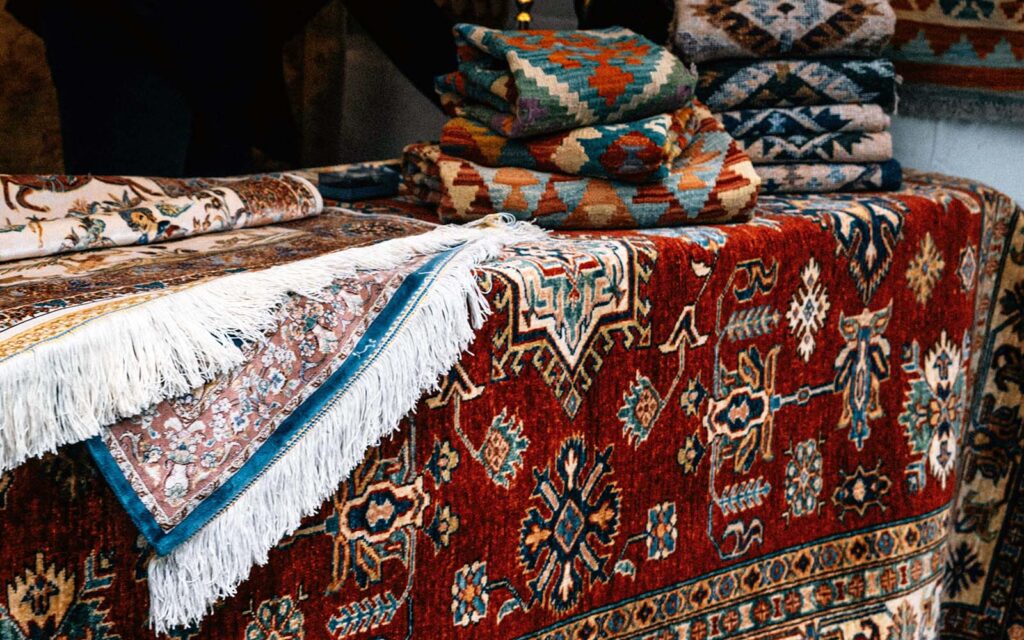 Bespoke custom rug with modern geometric design styled in a luxury interior by Ramsha Carpets