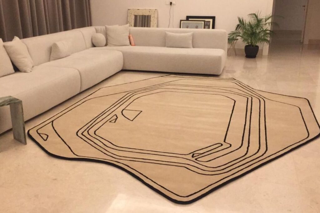 Custom-designed rug with abstract patterns styled in a high-end lounge by Ramsha Carpets