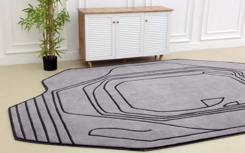 Luxurious custom carpet installed in a modern living room, crafted by Ramsha Carpets