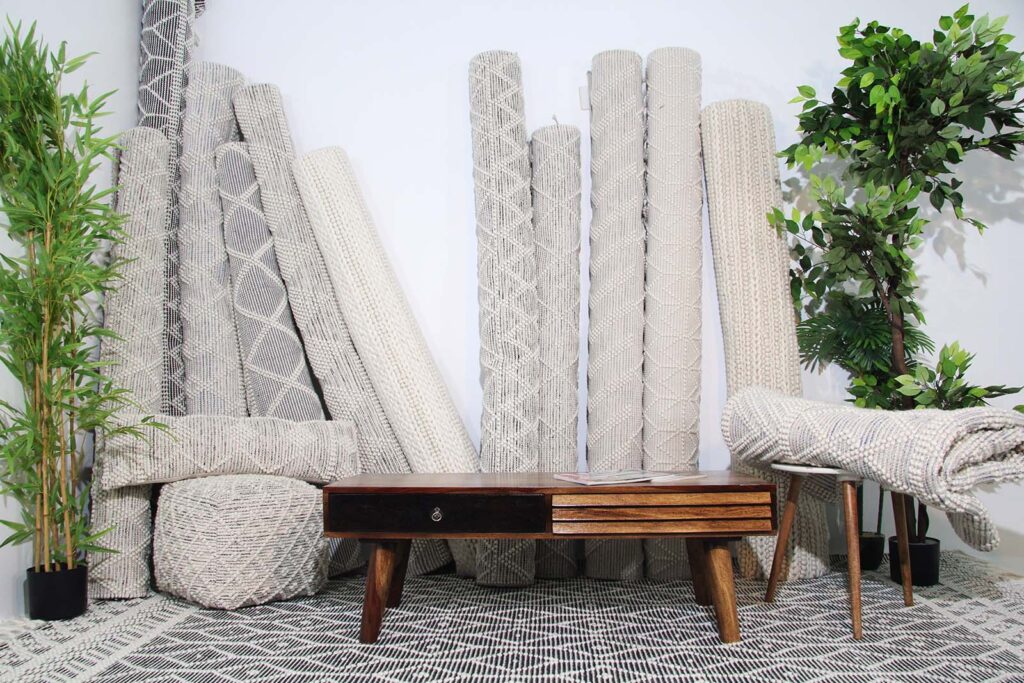 Elegant custom rug placed in a high-end living room interior, made by Ramsha Carpets