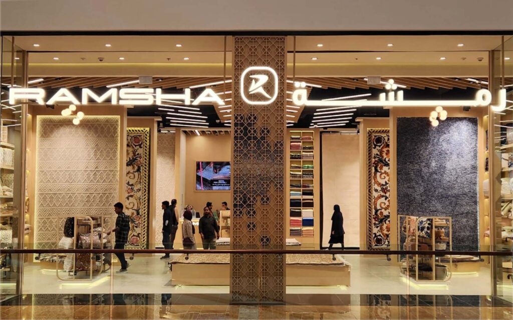 Interior view of Ramsha Carpets’ luxury showroom displaying a range of custom rugs and carpets