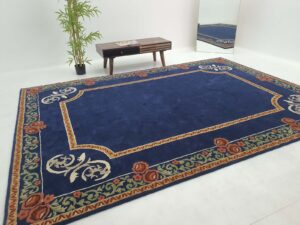 Selection of color poms and size templates used to create custom rugs at Ramsha Carpets