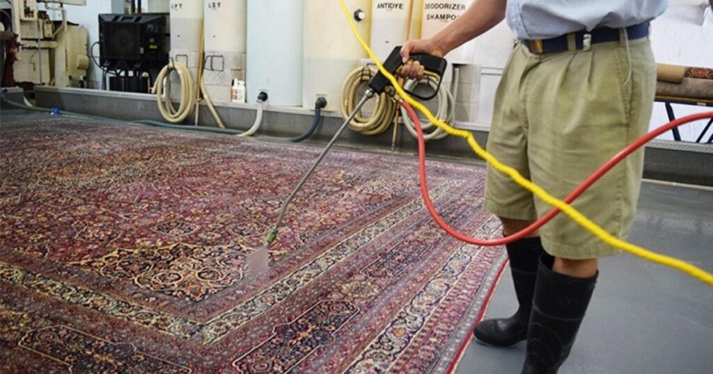 A family-friendly living room featuring easy to clean area rugs from Ramsha Carpets under a modern dining table.