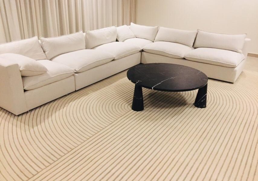 Custom rug with personalized design and color palette crafted by Ramsha Carpets for a modern interior